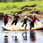 White Water Rafting in Perthshire Jumping into Water from boat